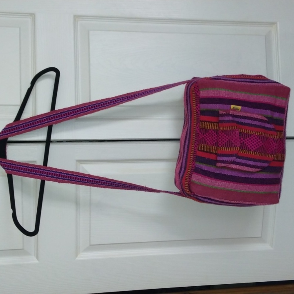 Artisanal pinks and purples women's embroidered duffle bag made in Mexico